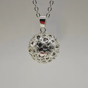 a silver ball necklace with circles on it